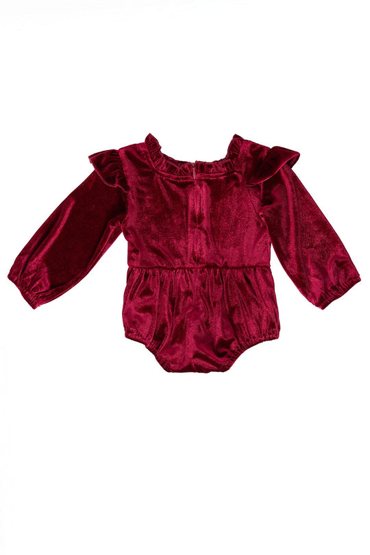 red velvet baby romper against a white background