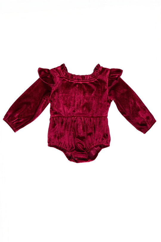 red velvet baby romper against a white background
