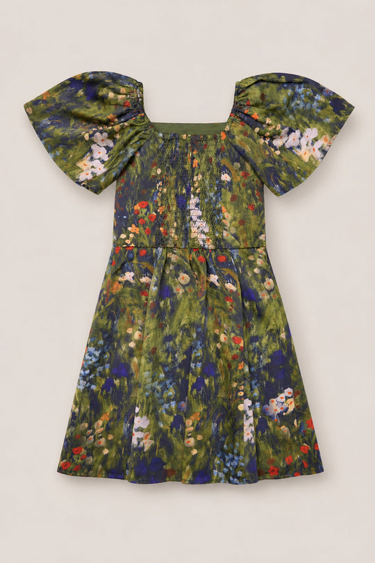The Teen Blakely Flutter-Sleeve Dress in Impressionist Bloom by Ivy City Co is a short satin dress with flutter sleeves, showcasing a vibrant mix of green, blue, and red floral patterns on a light background—an eye-catching piece to brighten up your fall wardrobe.