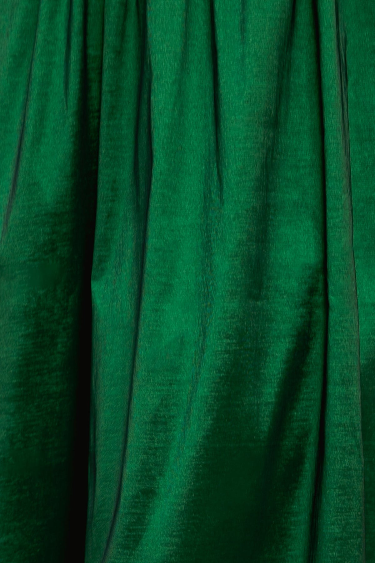 Close-up of gathered, emerald green fabric on the Cassie Dress in Green Taffeta.
