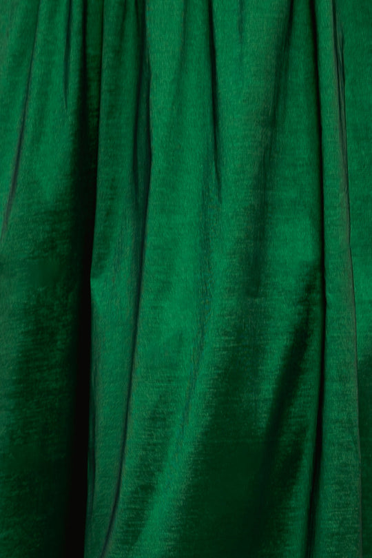 Close-up of gathered, emerald green fabric on the Cassie Dress in Green Taffeta.