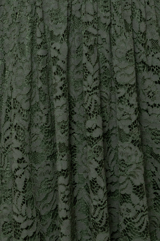 Close-up of the Penny Tank Midi Dress in Green Lace by Ivy City Co, featuring intricate floral-patterned lace with slight pleats and elegant texture—ideal for those seeking graceful detailing and sophisticated style.
