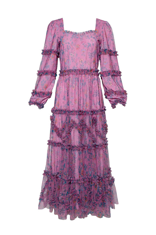 The Catherine Dress in Climbing Vine Bloom by Ivy City Co is a long-sleeved, ankle-length spring dress in a pink floral print, featuring delicate layered tiers, ruffle details, and a square neckline. Its slightly sheer fabric showcases the Climbing Vine Bloom motif for an effortlessly romantic look.