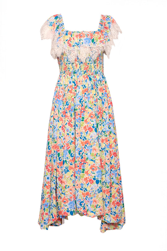 The Ada Dress in Vibrant Yarrow Print by Ivy City Co features a colorful floral chiffon design with a smocked bodice, flutter sleeves, and delicate lace trim at the neckline. Presented on a white background, this maternity-friendly dress perfectly combines comfort and style.