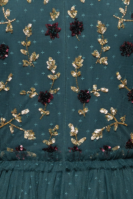 Teal fabric with gold and red floral embroidery
