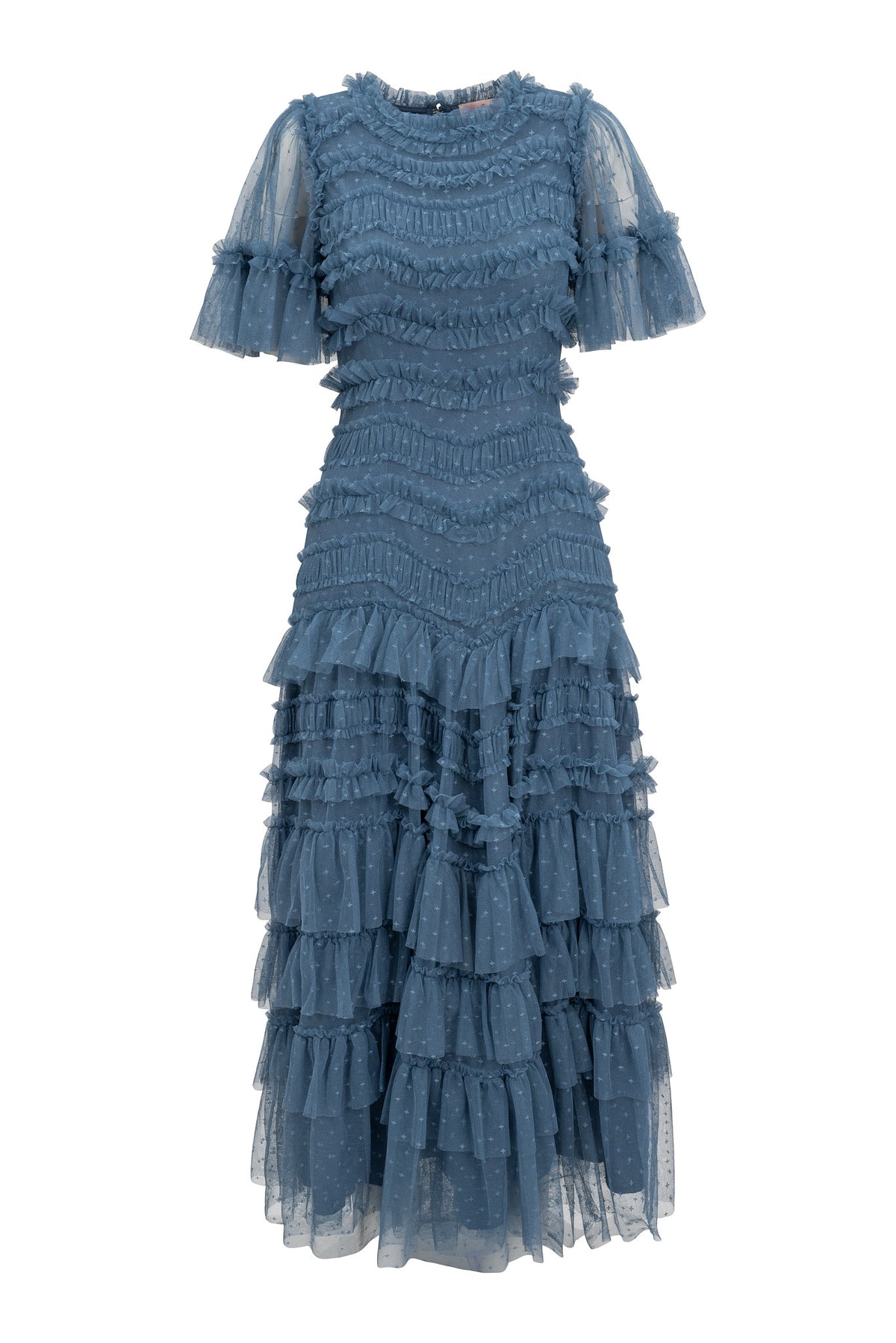 The Adriana Dress in Blue by Ivy City Co is a dusty blue, mid-length tulle dress with short sleeves, sheer polka dot fabric, a ruffled neckline, fitted waist, and a tiered skirt with textured horizontal ruffles.