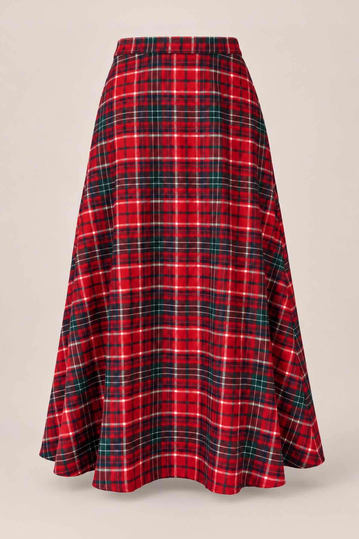 The Ana Skirt in Christmas Cheer Plaid by Ivy City Co, featuring a long, flared silhouette and a festive red, green, and white plaid pattern, is displayed on a plain light beige background.