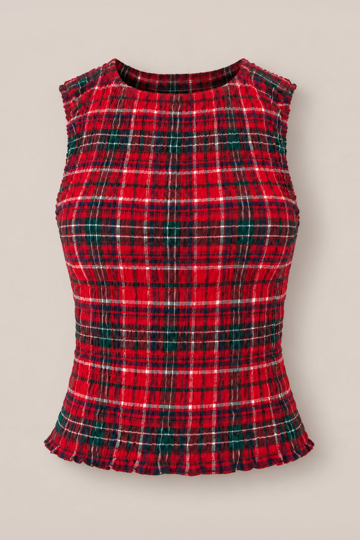 The Ana Top in Christmas Cheer Plaid by Ivy City Co is a sleeveless, fitted girls holiday tank featuring green and white stripes on red plaid, a ribbed texture, and ruffled edges at the hem and armholes—shown here against a plain beige background.
