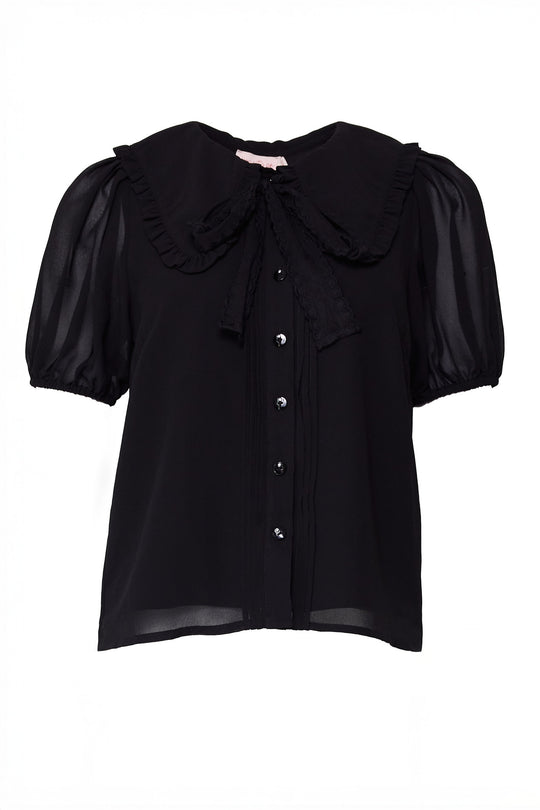 Black blouse with ruffled collar and puff sleeves on a white background with a tie under the collar