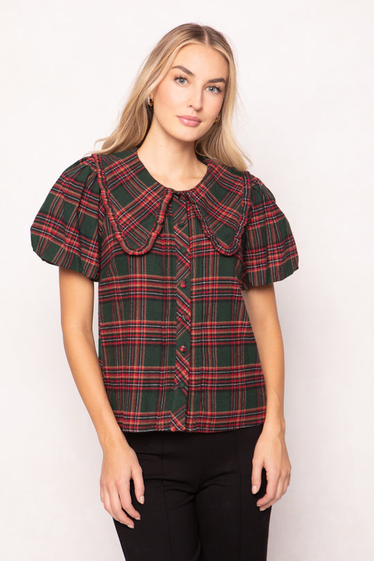 women wearing a evergreen plaid top on a white background 
