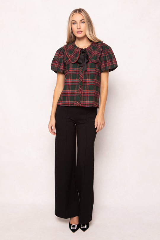 women wearing a evergreen plaid top on a white background 