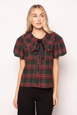 women wearing a evergreen plaid top on a white background 