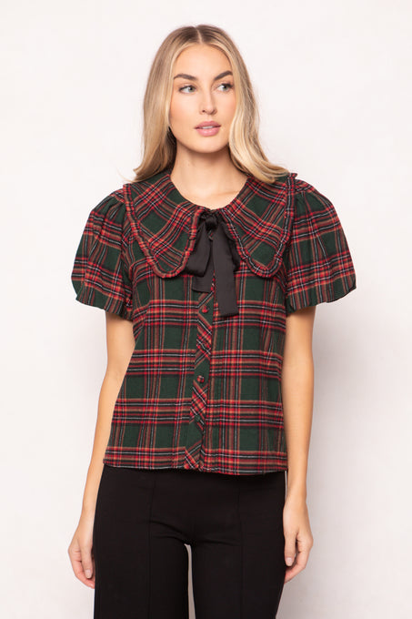 women wearing a evergreen plaid top on a white background 