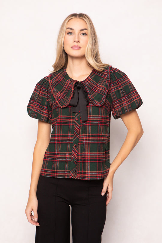 women wearing a evergreen plaid top on a white background 