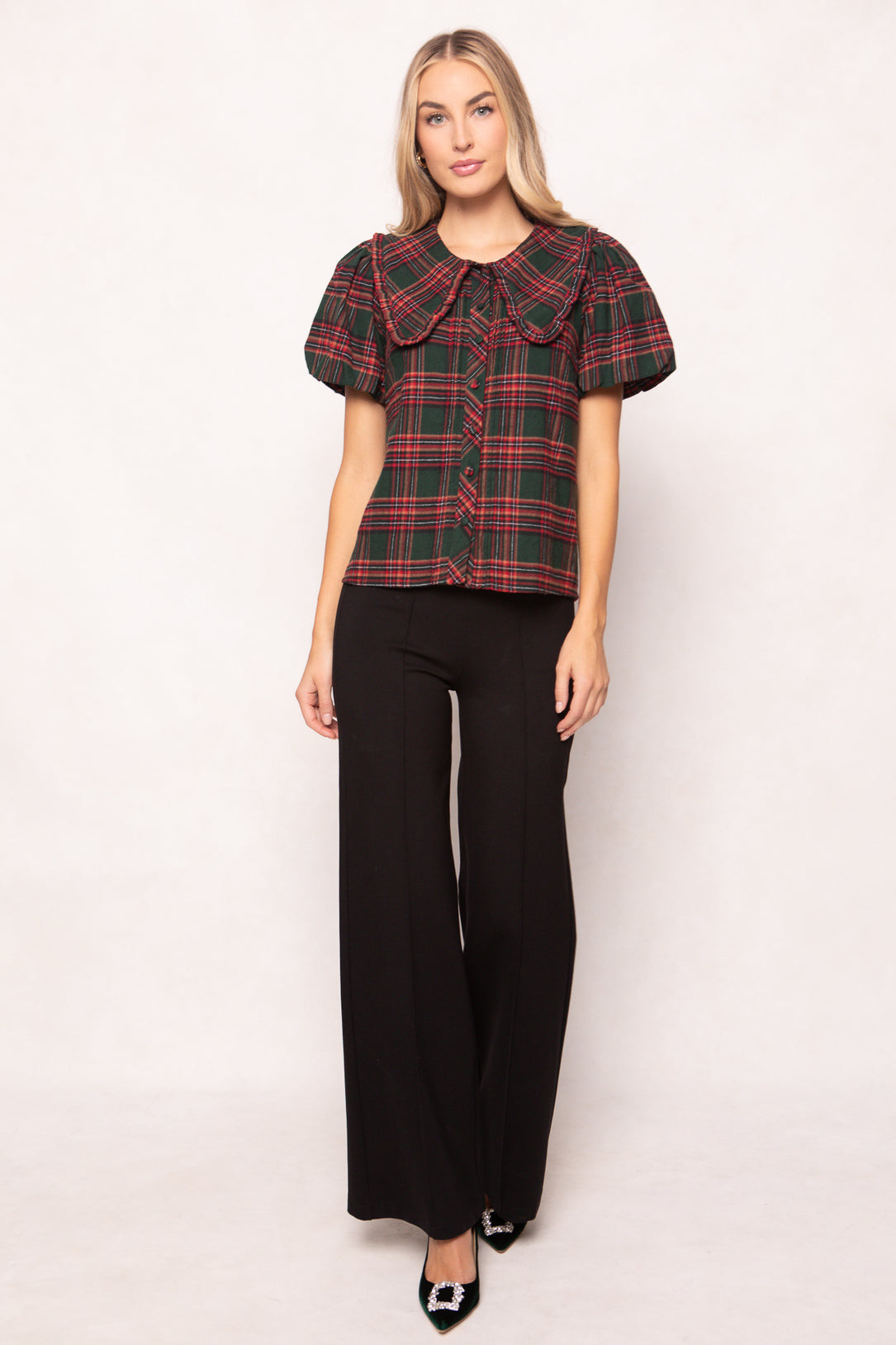 women wearing a evergreen plaid top on a white background 