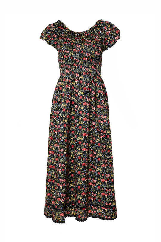 The Annalise Dress in Obsidian Vintage Poppies by Ivy City Co is ankle-length with short cap sleeves, a colorful small floral print, gathered smocked bodice, and a flared skirt—flattering and maternity-friendly.