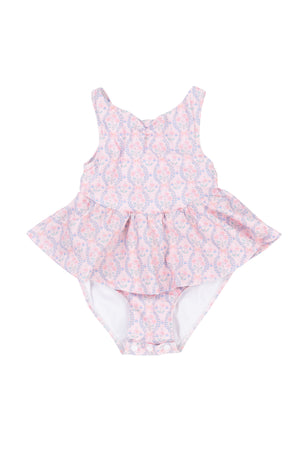 The Baby Bitsy Swim Dress in Raquel Pink Floral features a pink and white floral design with a ruffled skirt, perfect for baby girls. Displayed on a white background.