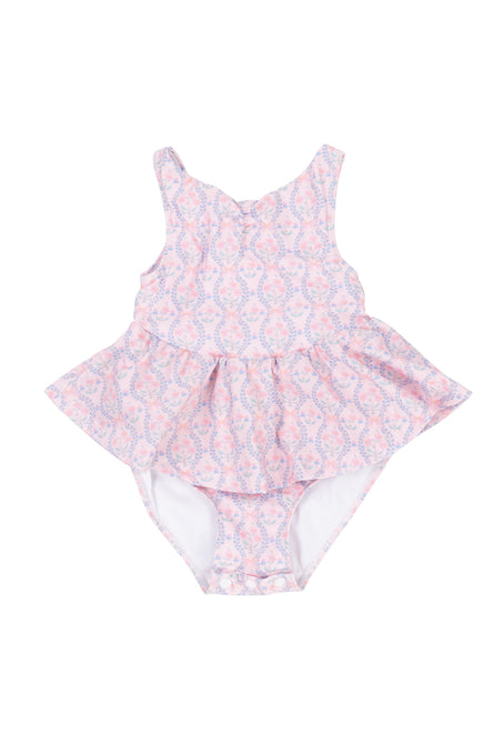 The Baby Bitsy Swim Dress in Raquel Pink Floral features a pink and white floral design with a ruffled skirt, perfect for baby girls. Displayed on a white background.