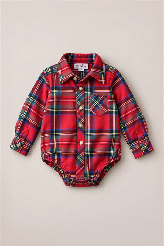 Introducing the Ivy City Co Baby Boys John Romper in Holiday Plaid—a festive red cotton bodysuit designed with a collar, front pocket, and button closures along the front and cuffs. Snap buttons at the bottom make diaper changes a breeze, merging holiday charm with comfortable practicality for your little one.