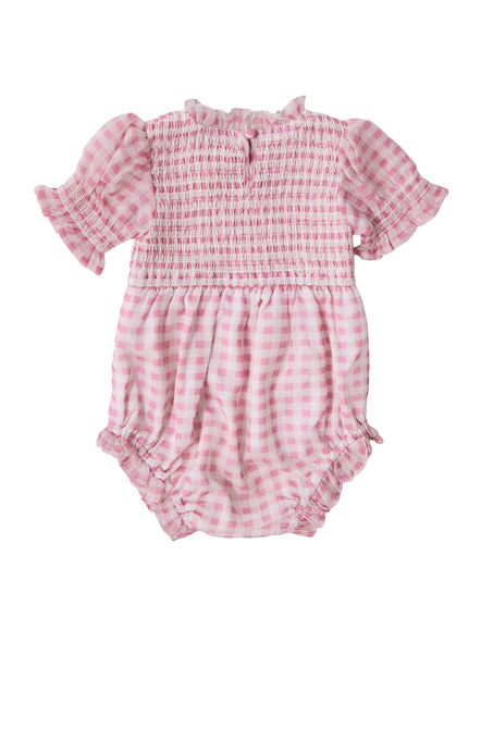 The Ivy City Co Baby Cordelia Romper in Desert Rose Gingham features short ruffled sleeves, a smocked bodice, gathered waist, and elastic leg openings—perfect for spring. Shown on a plain white background.