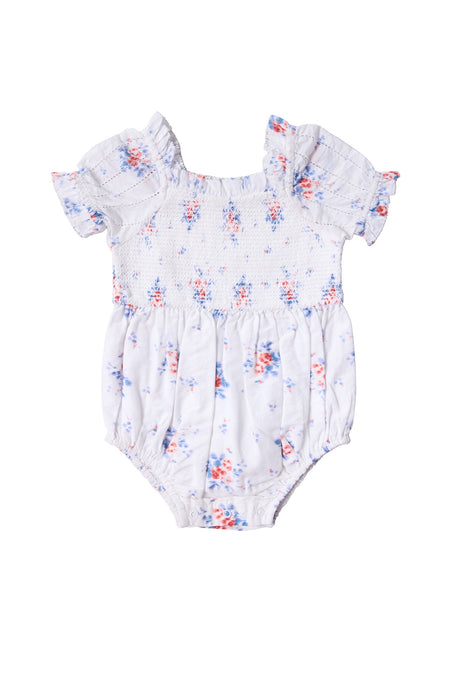 The Baby Emily Romper in Heritage Soft Ditsy Floral by Ivy City Co features a white ditsy print, short ruffled sleeves, smocked bodice, blue and pink florals, and gathered legs—ideal for a sweet mom and me matching look.
