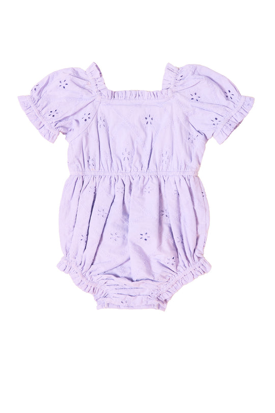 the back of a baby romper against a white background