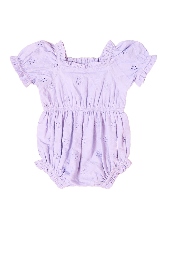 the front of a baby romper against a white background
