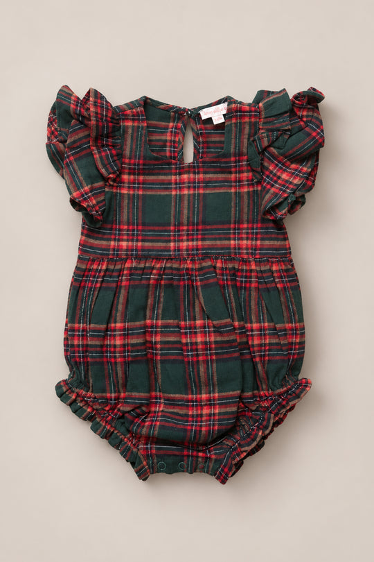 The Ivy City Co Baby Hattie Romper in Evergreen Plaid is a festive holiday outfit featuring short ruffled sleeves, a green and red plaid pattern, a small keyhole neckline, and elastic leg openings.