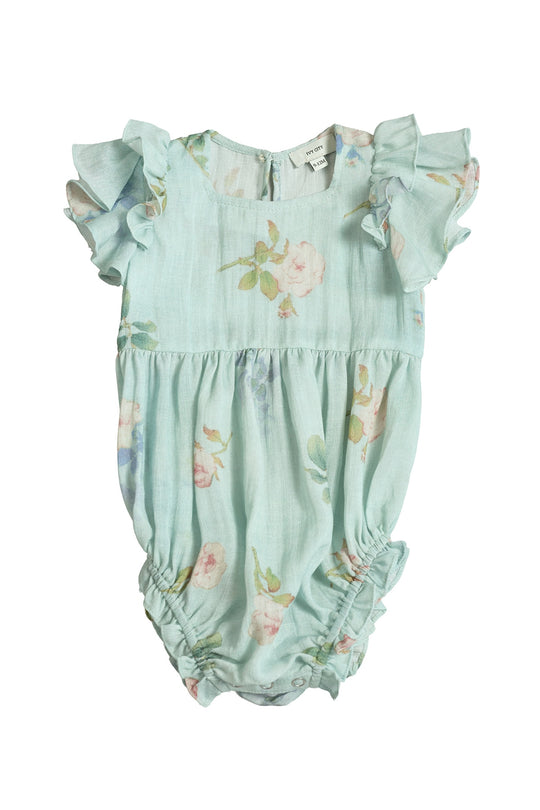 The Ivy City Co Baby Hattie Romper in Roselyn Blue features a light blue floral print, short ruffled sleeves, gathered leg openings, and a back button—perfect for adorable mommy and me outfits.