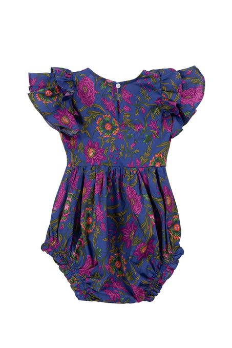 The Ivy City Co Baby Hattie Romper in Blue Multicolor Floral features flutter sleeves, a vibrant pink, red, and green floral print on deep blue, back buttons, and ruffled leg openings.