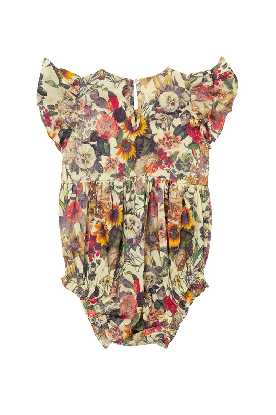 The Ivy City Co Baby Hattie Romper in Rose Vine has short ruffled sleeves, a vibrant floral print on a light background, gathered waist, elastic leg openings, and diaper snaps for easy changes.