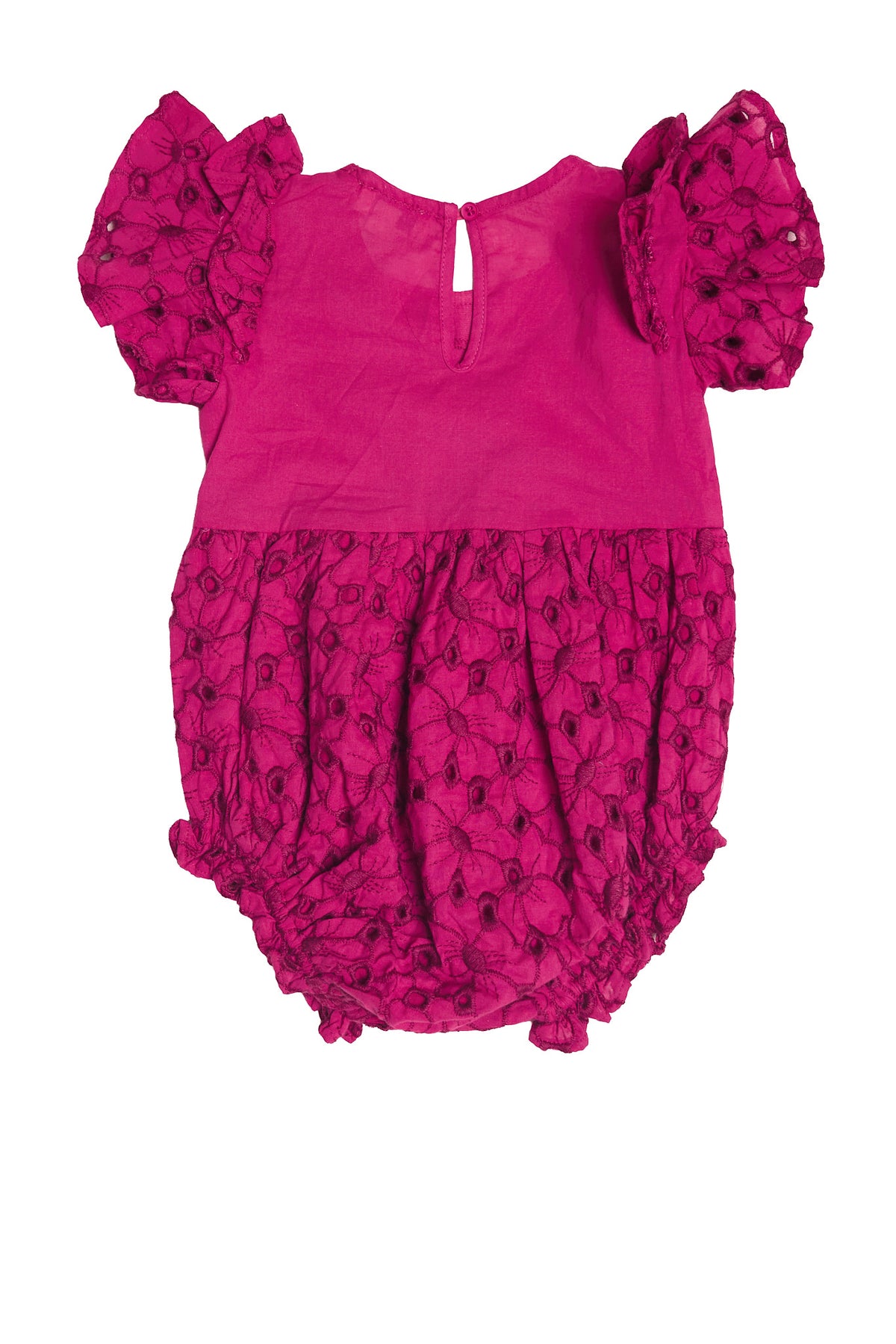 The Baby Hattie Romper in Magenta by Ivy City Co features short puffy sleeves, a round neckline, back button closure, and is made from embroidered eyelet cotton with floral details—perfect as an Easter outfit.