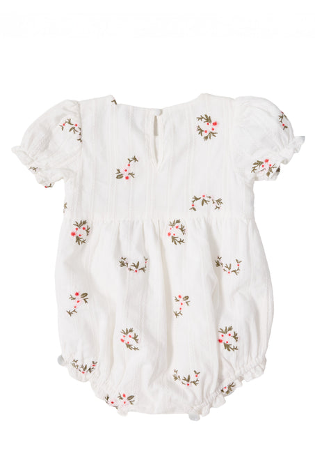 The Ivy City Co Baby Jessie Romper in Ditsy Embroidery features short puff sleeves, a smocked bodice, and pink and green floral embroidery on soft, lightweight striped cotton with elastic leg openings.
