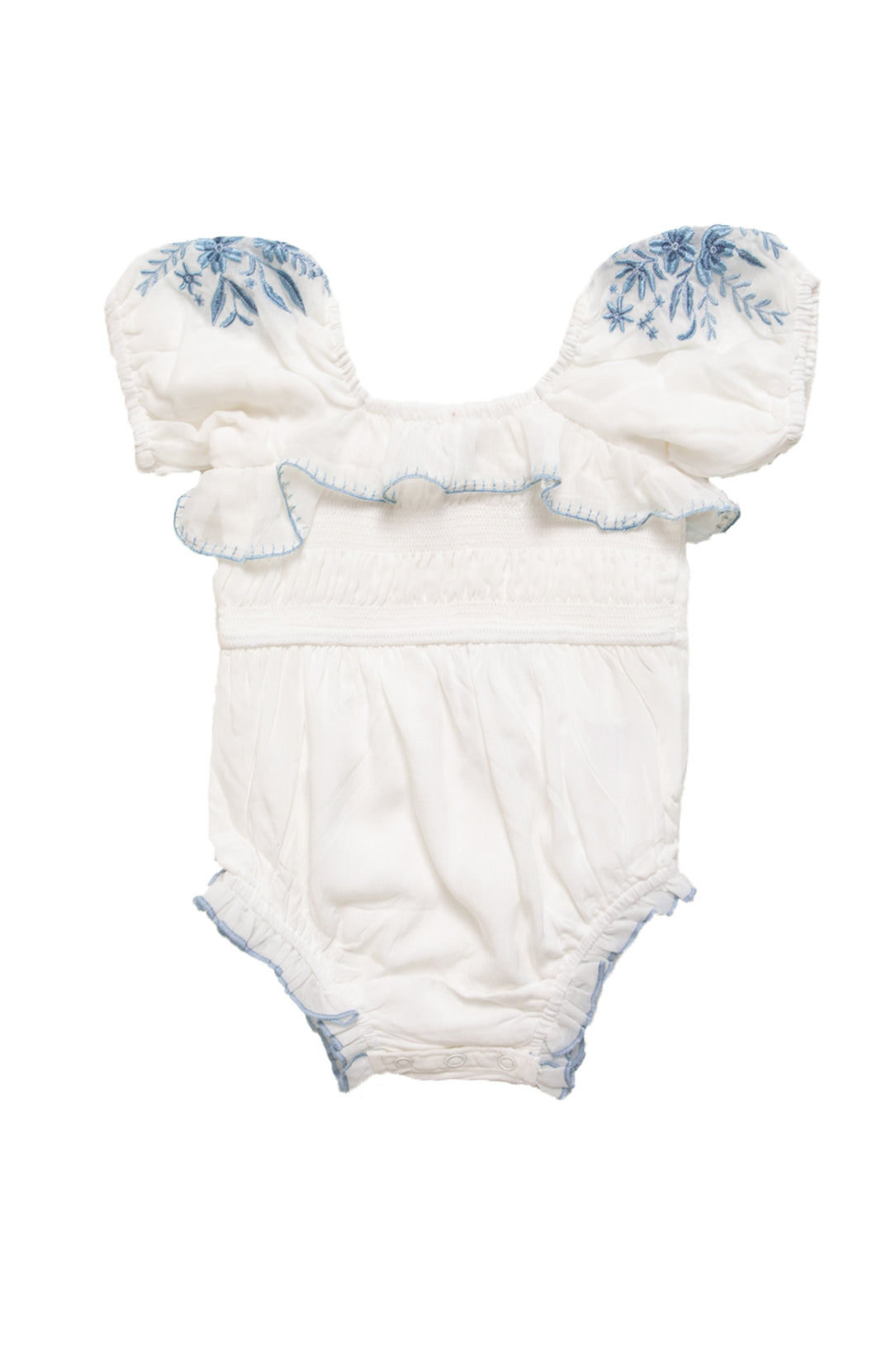 The Baby Mae Romper in White with Blue Floral by Ivy City Co features ruffled sleeves, a smocked bodice, blue floral embroidery on the shoulders, and delicate blue stitching. Soft cotton fabric makes it perfect for your little one.