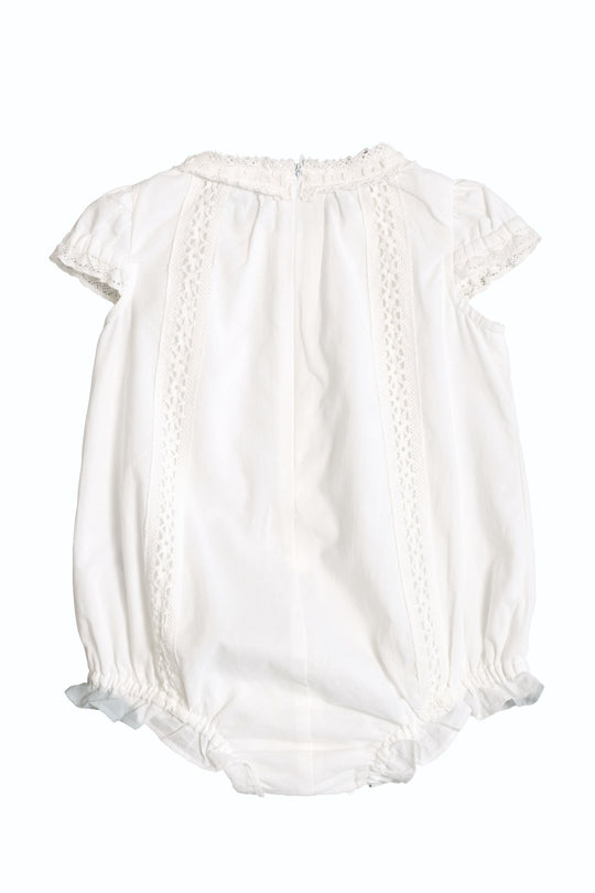 The Ivy City Co Baby Palermo Romper in White features short puffed sleeves, lace trim, and elastic leg openings—perfect for Mom and Me matching outfits. Shown on a plain white background.