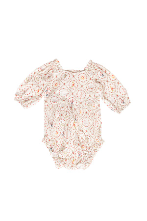 Floral baby romper on a white background