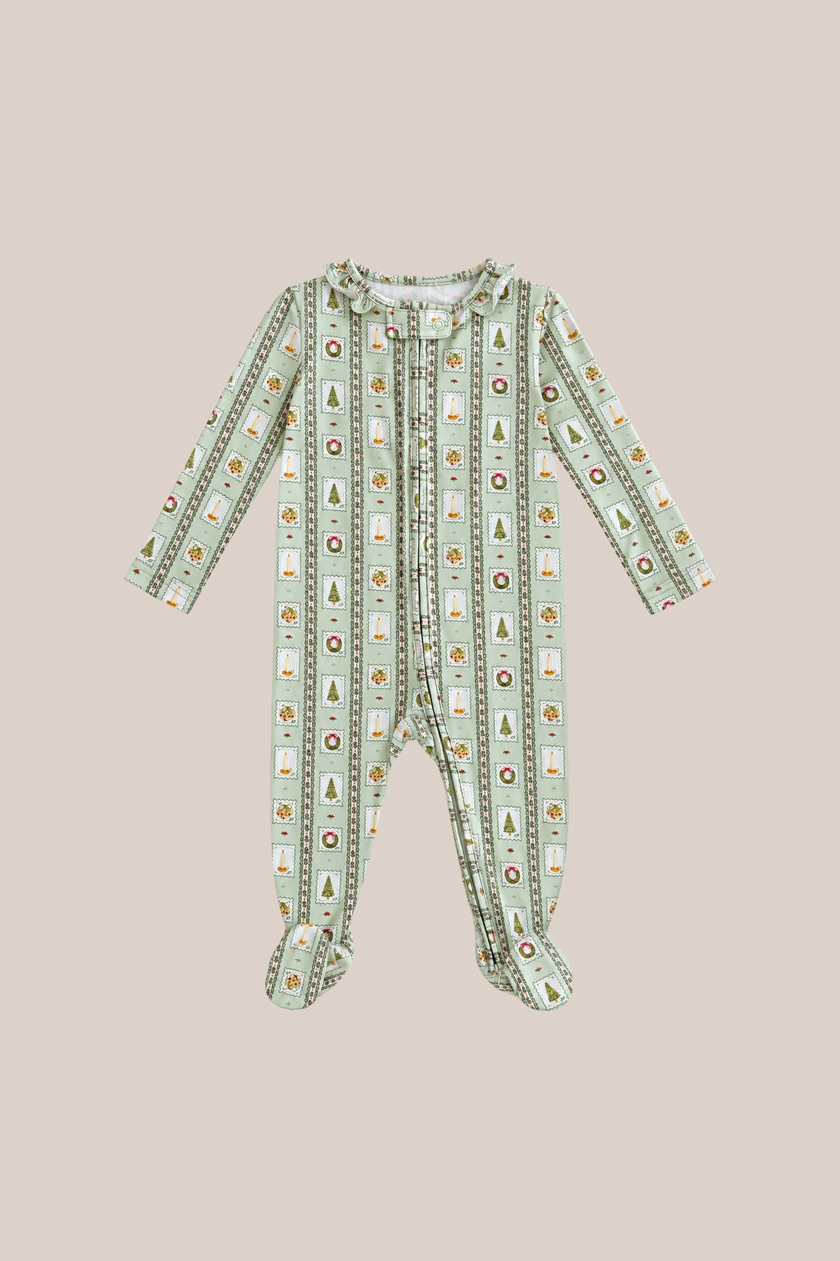 The Baby So Soft Onesie in Merry Mail Linear by Ivy City Co is a long-sleeved, footed sleeper in soft cotton-modal knit with green and white stripes plus cheerful holiday patterns, shown laid flat on beige.
