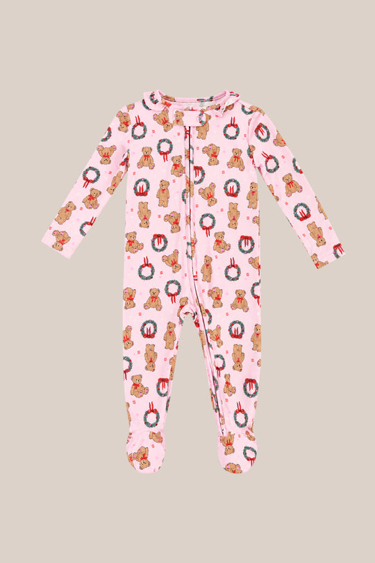 The Ivy City Co Baby So Soft Onesie in Teddy Bear Wreaths features pink, long sleeves, soft cotton-modal knit, gingerbread men and wreath patterns, plus a convenient front zipper closure—perfect for holiday comfort.