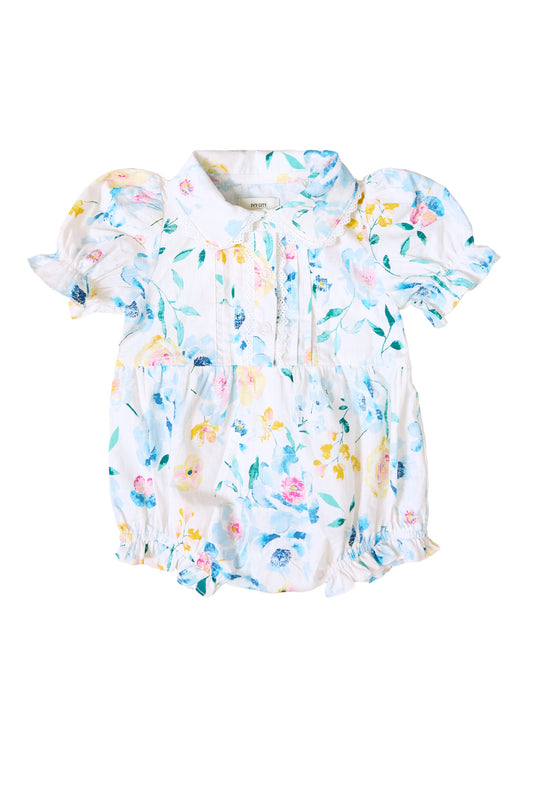 the front of a blue baby romper against a white background