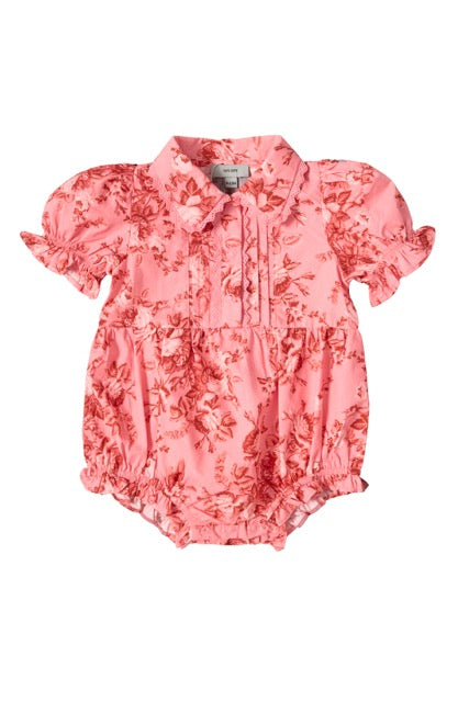 Dress your little one in the Ivy City Co Baby Sophia Romper in Desert Heritage Rose, featuring short puffed sleeves, a collar, floral pattern, ruffled edges, and button details—perfect for Easter or any special occasion.