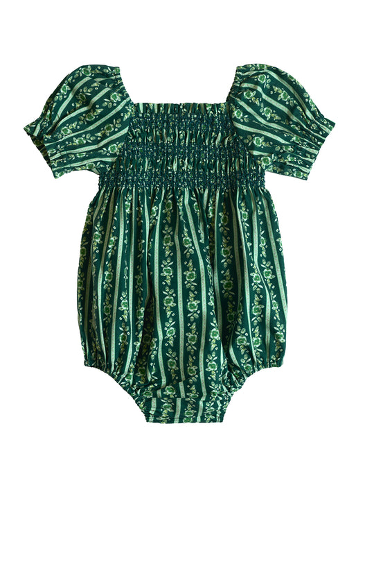 The Ivy City Co Baby Sunday Best Romper in Pine Felicity Floral features short puff sleeves, a smocked bodice, and vertical pine floral stripes in a bubble silhouette, shown against a white background.
