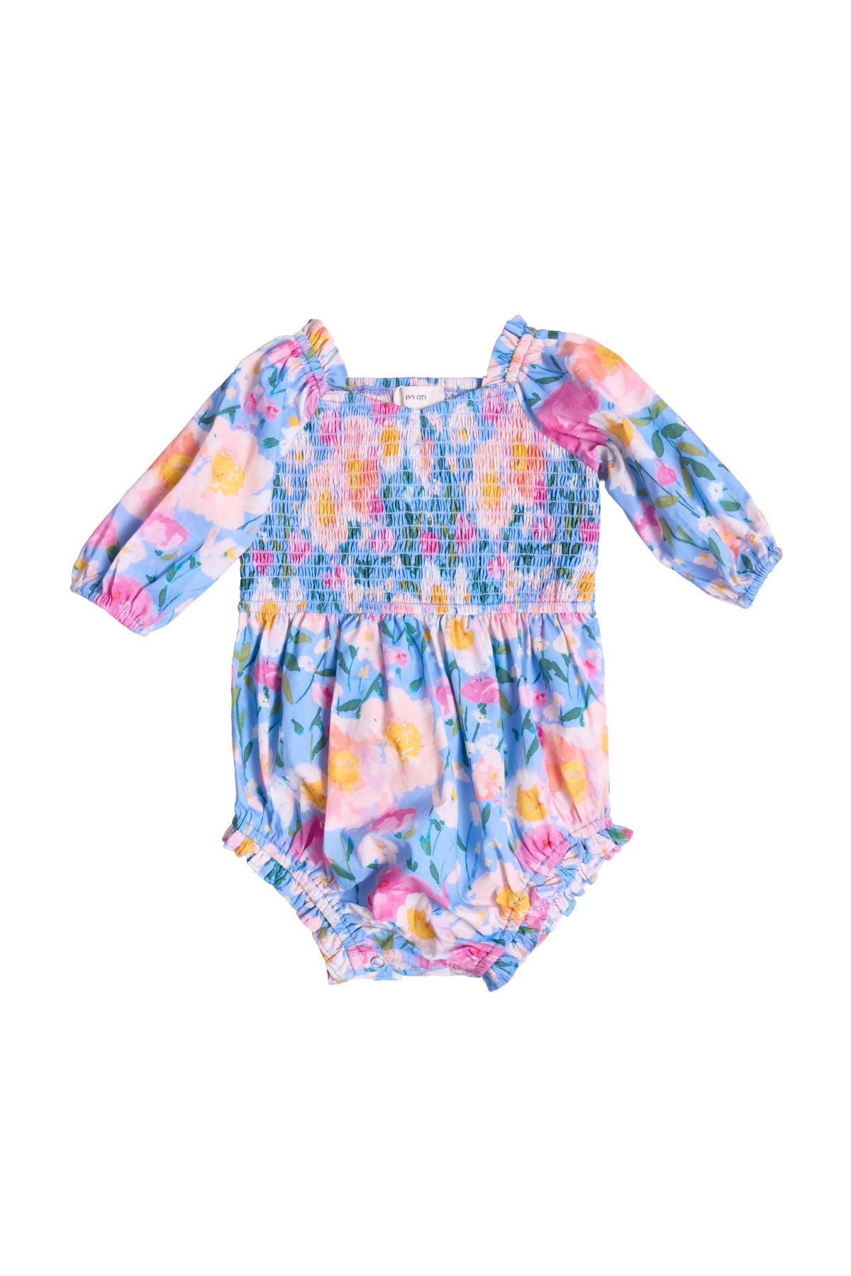 The Baby Teagan Romper in Delia Blue by Ivy City Co features long sleeves, a smocked bodice, and ruffled leg openings—perfect for mommy-and-me outfits or pairing with the Delia Blue collection.