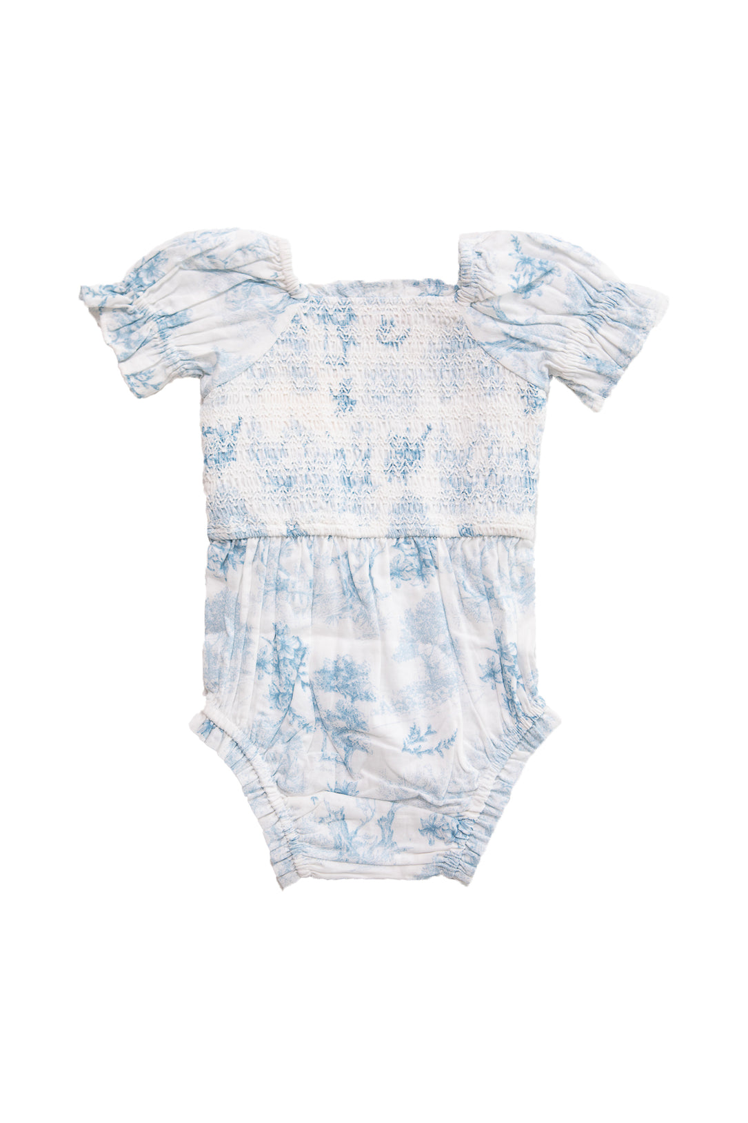 The Ivy City Co Baby Valencia Romper features light blue and white cotton, puff sleeves, a smocked bodice, and a delicate floral toile print, shown against a plain white background.