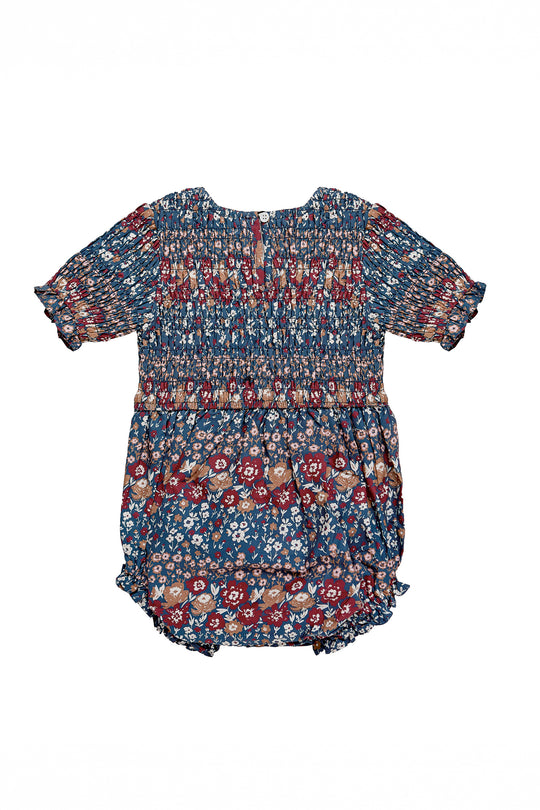 Floral baby romper with floral print on a white background