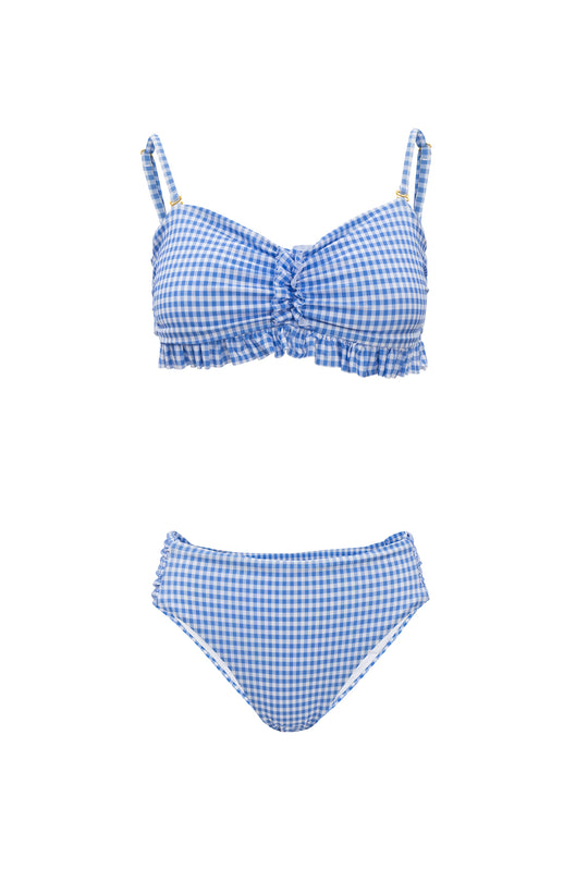 The Ivy City Co Mid Rise Ruched Bottom in Blakely Gingham features a blue and white gingham pattern with ruched detailing, ruffled trim, and a cheeky fit bikini bottom, shown on a white background.