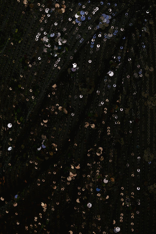 Close-up of black fabric with scattered sequins
