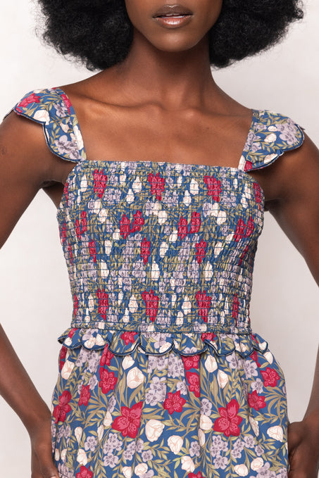Woman wearing a floral dress with a white background