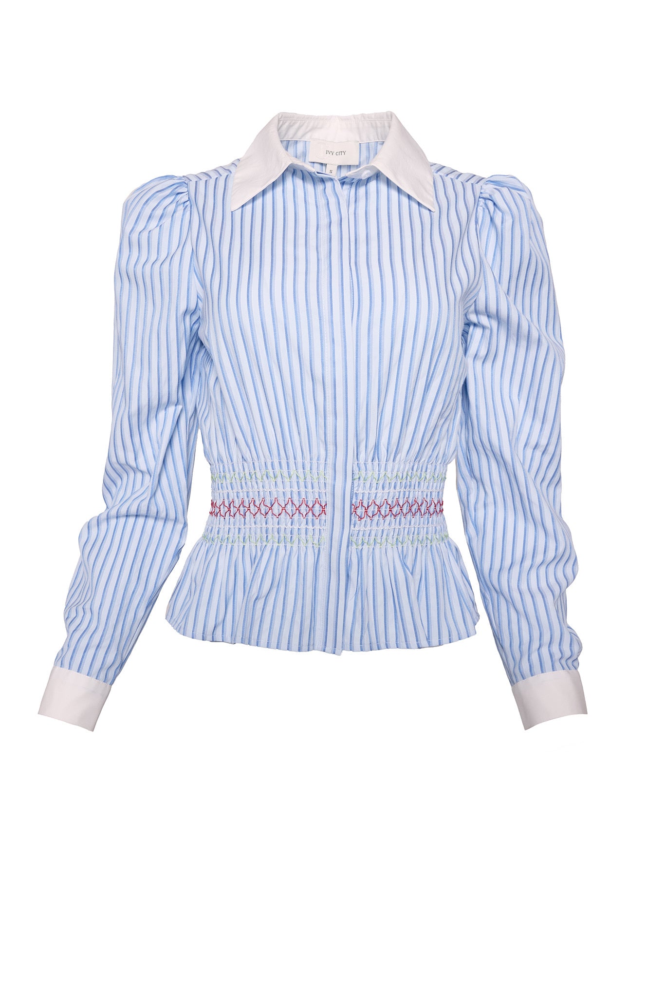 The Bluebell Top in Blue & White Stripes by Ivy City Co features long sleeves, a white collar and cuffs, puffed shoulders, a smocked waistband with red and blue embroidery, and is nursing friendly for convenience.