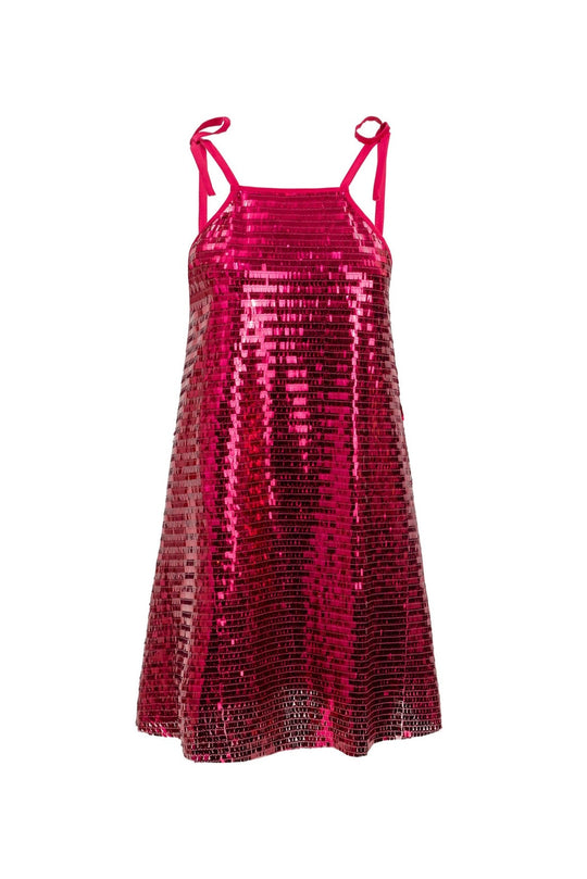 The Zelda Dress in Fuchsia Shingle Sequin by Ivy City Co is a sleeveless, A-line dress adorned with shiny pink sequins and finished with thin shoulder straps tied into bows—perfect as a sparkling party dress.