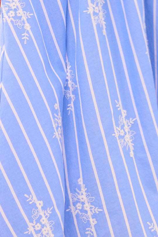 Blue fabric with white floral stripes